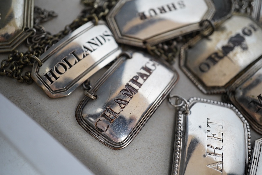 A collection of thirty two silver plated mostly named spirit labels, from the 19th century and 20th century, largest ‘Lisbon’ 6cm wide. Condition - a few where the plate has worn but most good